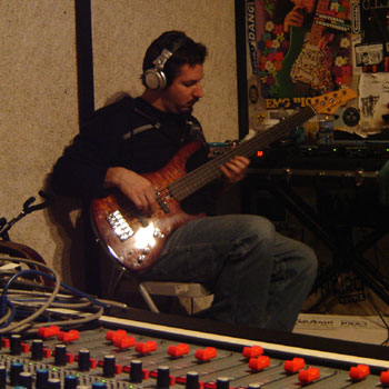 Bryan Beller playing a fretless bass guitar