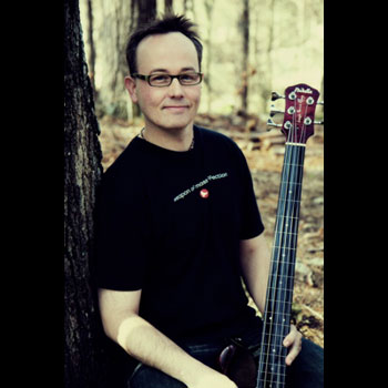 Joseph Patrick Moore playing fretless bass guitar