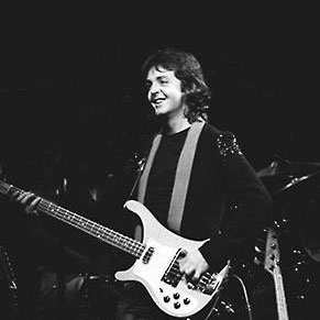 Paul McCartney playing bass guitar