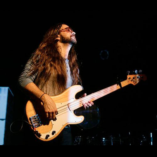 Roy Mitchell-Cardenas playing fretless bass guitar