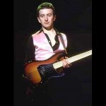 John Deacon playing fretless bass