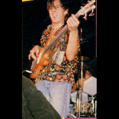 Paul Webb playing fretless bass guitar